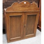 An Oak Country House Office Letter Box, circa 1900-20, with arched pediment fitted with pigeon holes