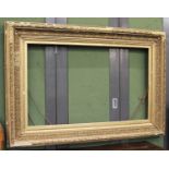 A 19th Century Gilt and Gesso Picture Frame, 164cm by 113cm, aperture 75cm by 126.5cm