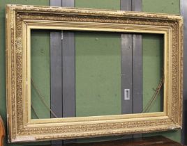A 19th Century Gilt and Gesso Picture Frame, 164cm by 113cm, aperture 75cm by 126.5cm
