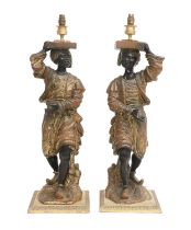 A Pair of Gilt and Painted Composition Figural Lamp Bases, in the form of Blackamoors, 85cm