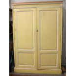 A Georgian Cream Painted Two Door Wardrobe, 145cm by 54cm by 209cm