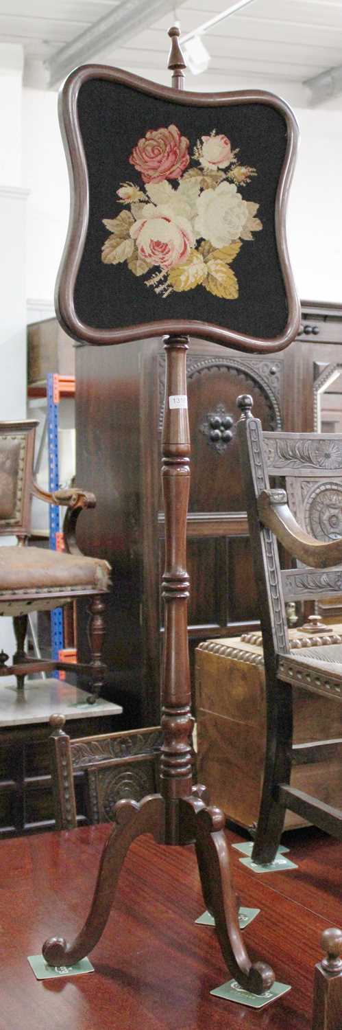 A William IV Mahogany Polescreen, the shaped needlework panel on a turned support, issuing three - Image 2 of 3