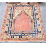 Turkish Prayer Rug, the terracotta field beneath a stepped Mihrab enclosed by pale lemon borders