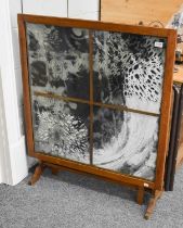 An Unusual Oak Framed Tilt Top Coffee Table/Firescreen, the top with cloth panel painted with