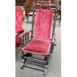 An American Rocking Chair, early 20th century, with typical turned frame and part upholstered
