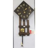 An Arts and Crafts Oak and Brass Mounted Striking Wall Clock, 80cm high