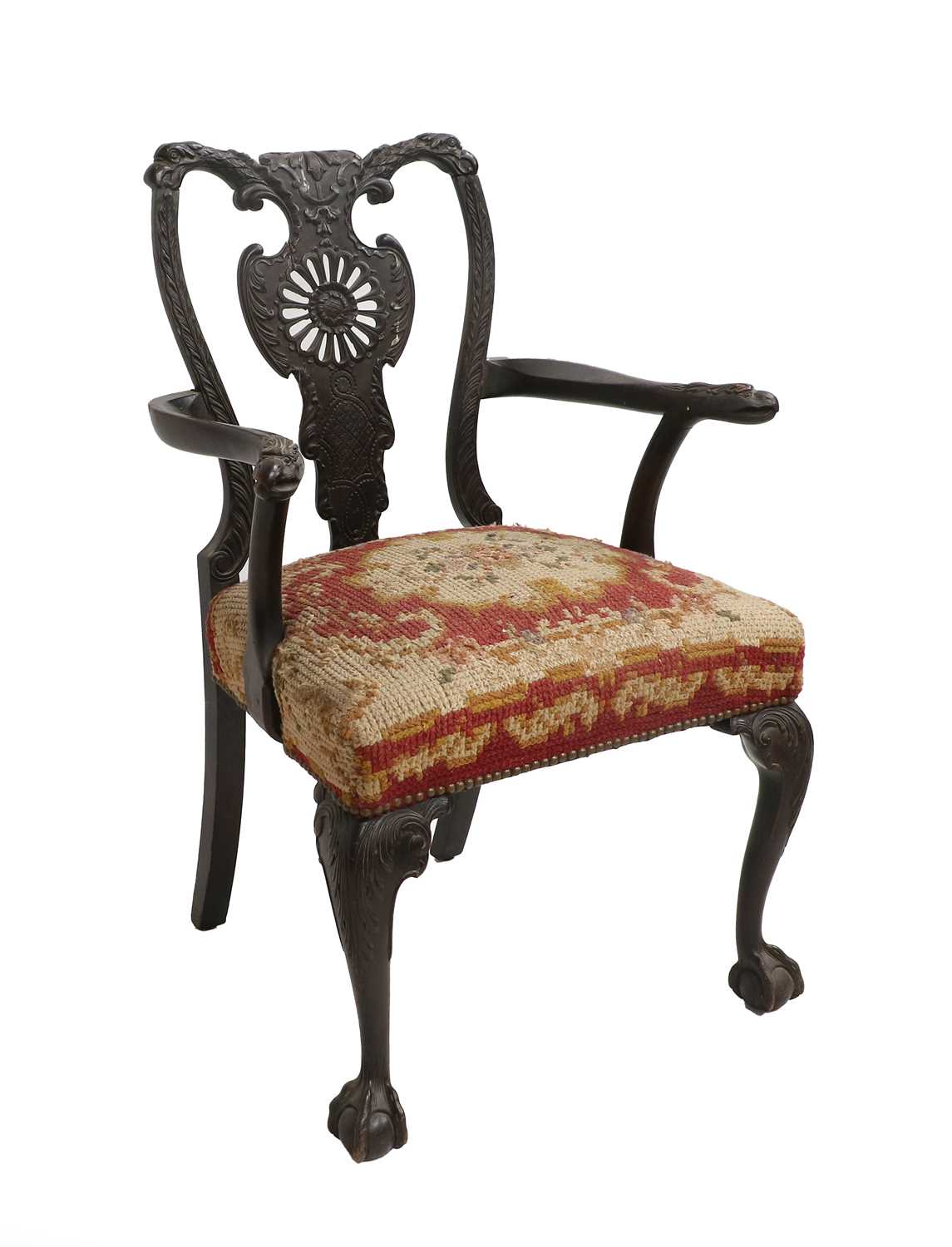 An Ornate 19th Century Carved Open Armchair, carved with eagle head crest rail and arms on claw