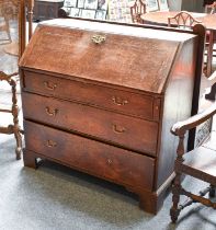 A George III Oak Bureau, 112cm by 54cm by 109cm