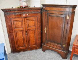 An 18th Century Inlaid and Cross-banded Oak and Mahogany Hanging Corner Cupboard, with carved frieze