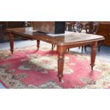 A Victorian Mahogany Wind-Out Extending Dining Table, with four leaves, the moulded top raised on