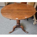 A George III Provincial Oak Tripod Table, on pad feet, 83cm by 70cm