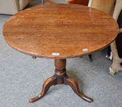 A George III Provincial Oak Tripod Table, on pad feet, 83cm by 70cm