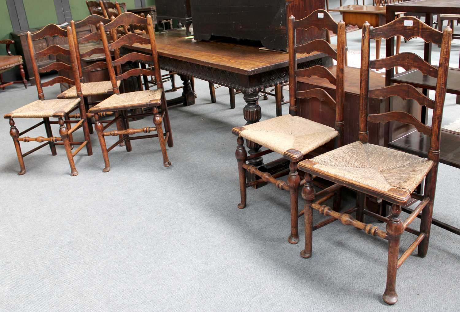 A Carved Oak Refrectory Table, 214cm by 77cm by 76cm; together with a Harlequin set of five ladder