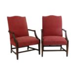 A Pair of 19th Century Mahogany Gainsbrough Chairs, One chair with a repaired arm, both with some