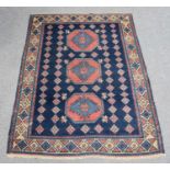 Yerevan Rug, the inidigo field centred by three octagons enclosed by ivory borders of stepped