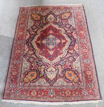 Saroukh Rug, the field of scrolling floral vines centred by a blood red and sky blue medallion,