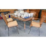 A Metal and Wicker Glass Topped Dining Table and Six Matching Chairs, including two carvers (7)