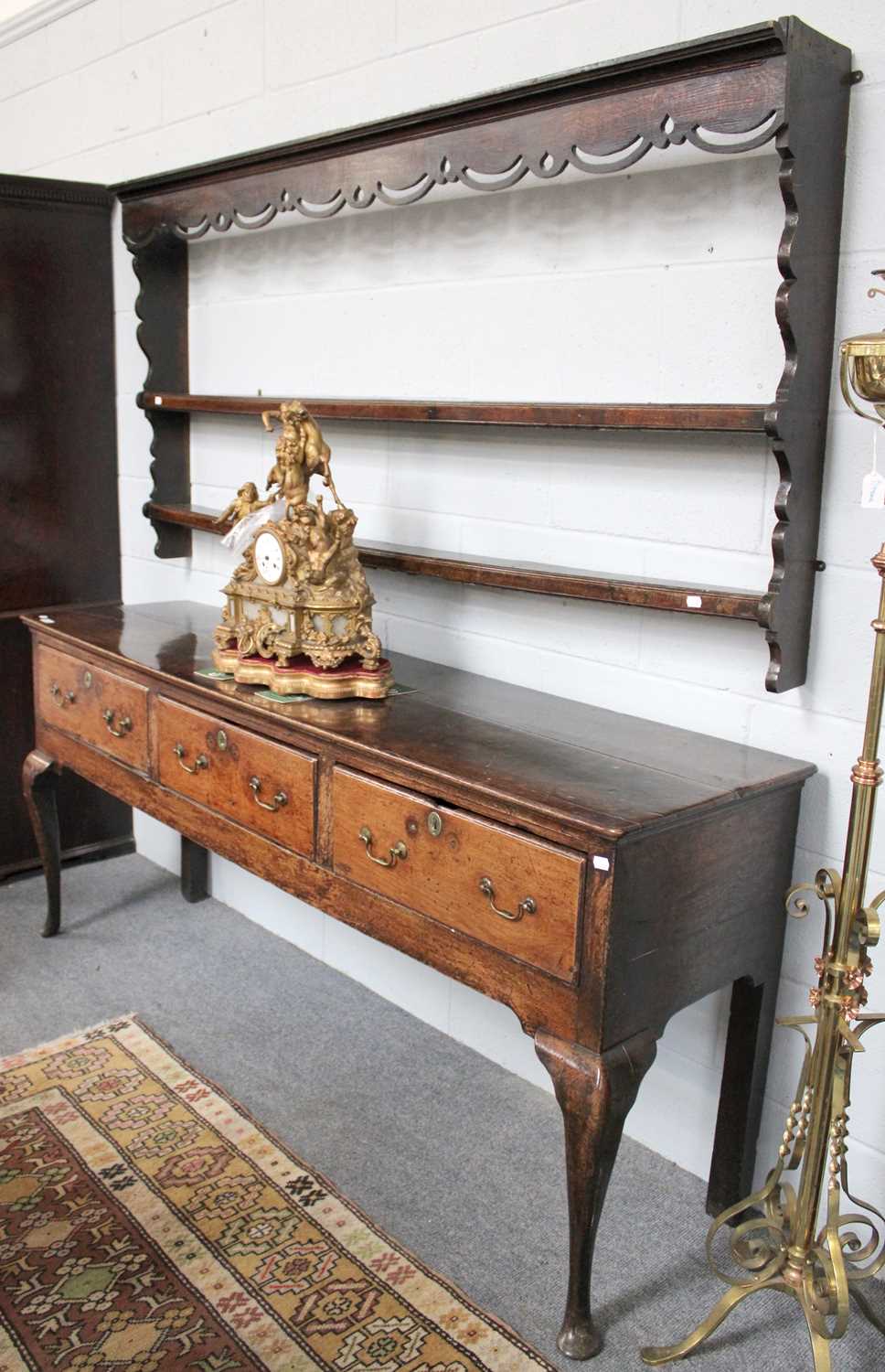 An 18th Century Oak Three Drawer Dresser Base, 187cm by 50cm by 83cm together with an associated