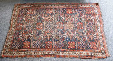 Afshar Rug, circa 1920, the field with columns of flowerheads and angular vines enclosed by ivory