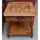 A 20th Century Carved Oak Two Tier Lamp Table, fitted with a drawer, decorated with lunette carving,