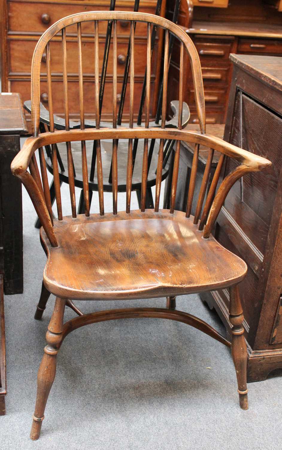 An Early 20th Century Elm Windsor Chair, with crinoline stretcher and dished seat