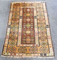 Melas Rug, the chocolate brown field with six diamond medallions enclosed by borders of angular