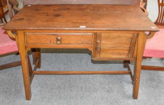 An Arts and Crafts Walnut Washstand, rectangular top above a cupboard and drawer with copper