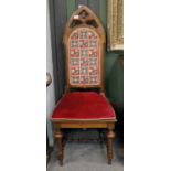 A Victorian Gothic Walnut High Back Side Chair, with cane seat and loose seat squab