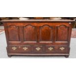 An 18th Century Oak Mule Chest, with four arched moulded panels flanked by quarter columns, and