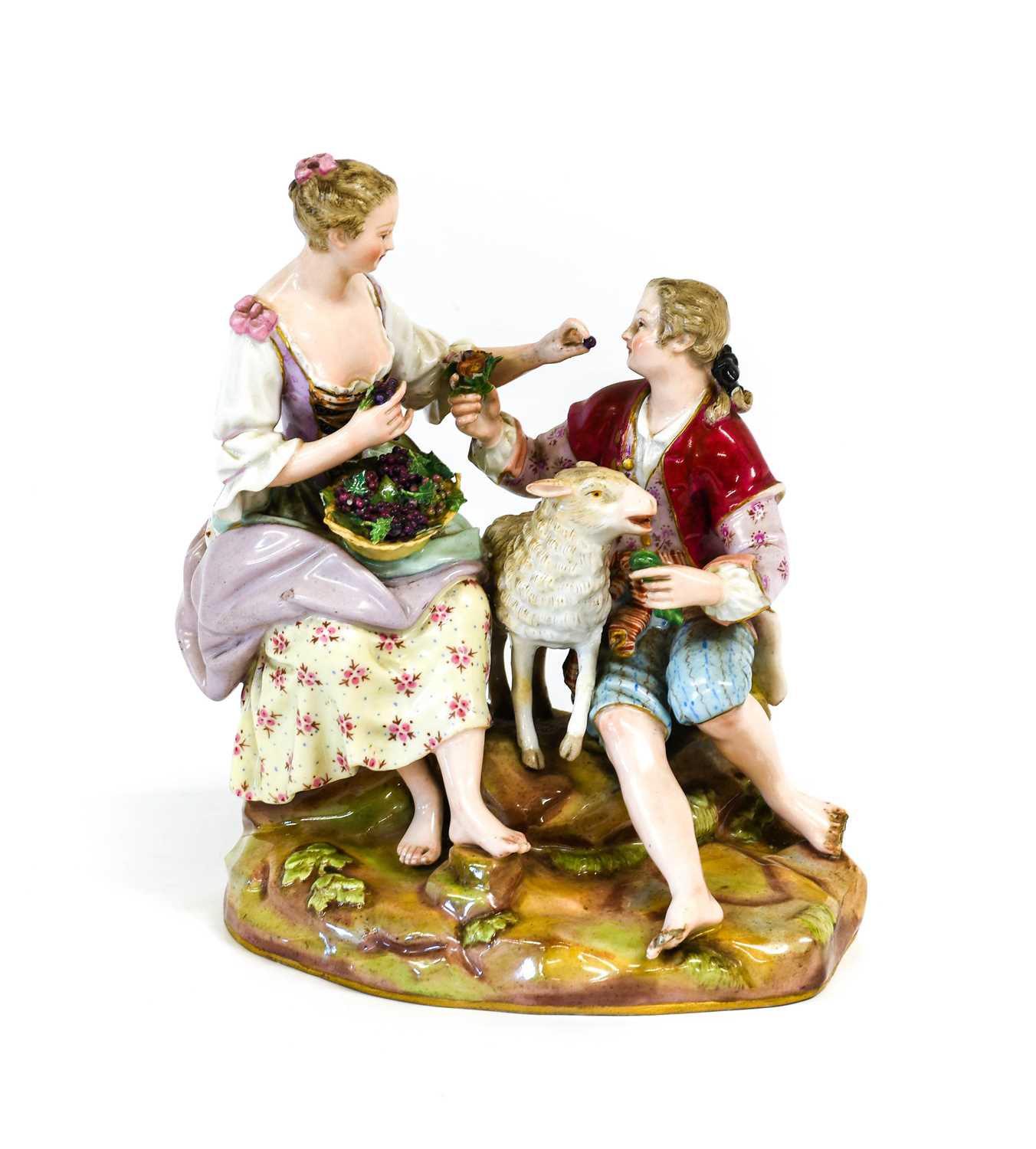 A Meissen Porcelain Figure Group of a Shepherd and Shepherdess with Ewe, 19th century, both seated