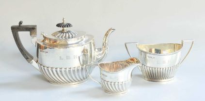 A Three-Piece Silver Tea-Service, by Walker and Hall, Sheffield, The Cream-Jug 1901, The Other