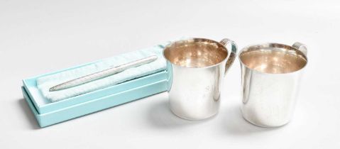 A Pair of American Silver Mugs, by Tiffany and Co., New York, 20th Century; each tapering and with