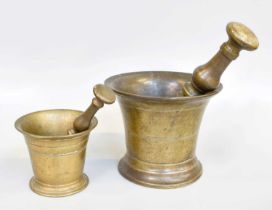 A Bronze Pestle and Mortar, 18th century, with double side pestle having knopped handle, 19cm