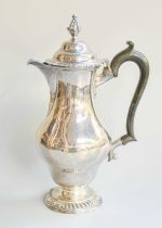 An Edward VII Silver Hot-Water Jug, by John Bodman Carrington, London, 1903, in the George II style,