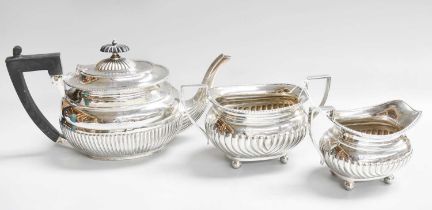 A Three-Piece Assembled Victorian and George V Silver Tea-Service, The Teapot by William