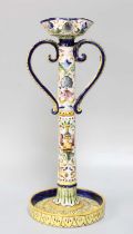 A 19th Century Continental Faience Candlestick, 39cm high