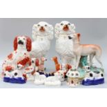 A Collection of Victorian and Later Staffordshire Pottery Models, mainly dogs, including a large
