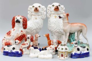 A Collection of Victorian and Later Staffordshire Pottery Models, mainly dogs, including a large