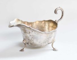 A George V Silver Sauceboat, by Adie Brothers, Birmingham, 1925, oval and on three stepped pad feet,