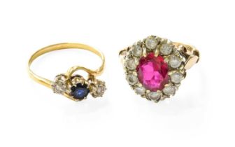 A 9 Carat Gold Synthetic Ruby Cluster Ring, the oval cut synthetic ruby within a border of cubic