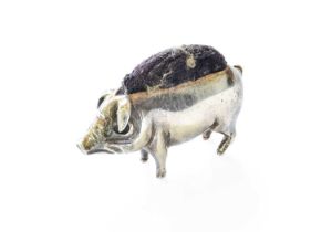 A Silver Pin-Cushion, in the form of a pig, with blue velvet cushion The pin cushion with modern