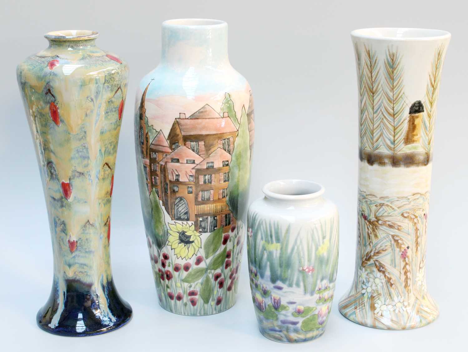 Four Cobridge Vases, including 'Lower Harts' Windmill pattern by Rachel Bishop, and another by Anita