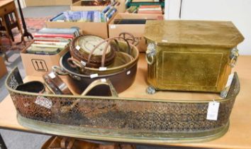 A George III Brass and Cast Iron Fire Basket, with pierced serpentine front and four urn shaped