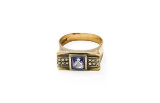 A Synthetic Sapphire and Diamond Ring, the square cut sapphire in a white rubbed over setting,