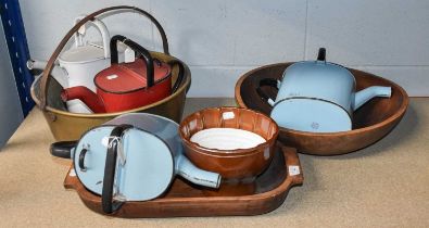 A Small Treen Dough Trough, A Similar Dug Out Bowl, Two Stoneware Jelly Moulds, Four Enamel Watering