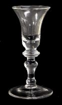 A Wine Glass, circa 1740, the bell-shaped bowl with annular basal knop on a baluster stem and