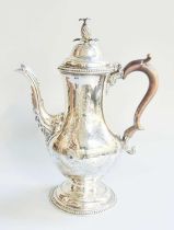 A George III Silver Coffee-Pot, Maker's Mark Rubbed, London, 1778, pear-shaped and on spreading