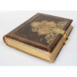 A Victorian Leather and Brass-Bound Photograph Album, part filled with portraits