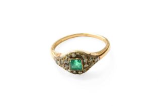 An Emerald and Diamond Cluster Ring, the square cut emerald in a yellow rubbed over setting,