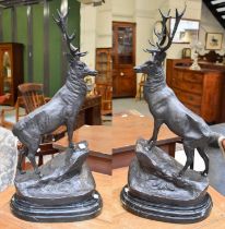 After Jules Moigniez (1835-1894) French: a pair of reproduction patinated bronzed metal sculptures